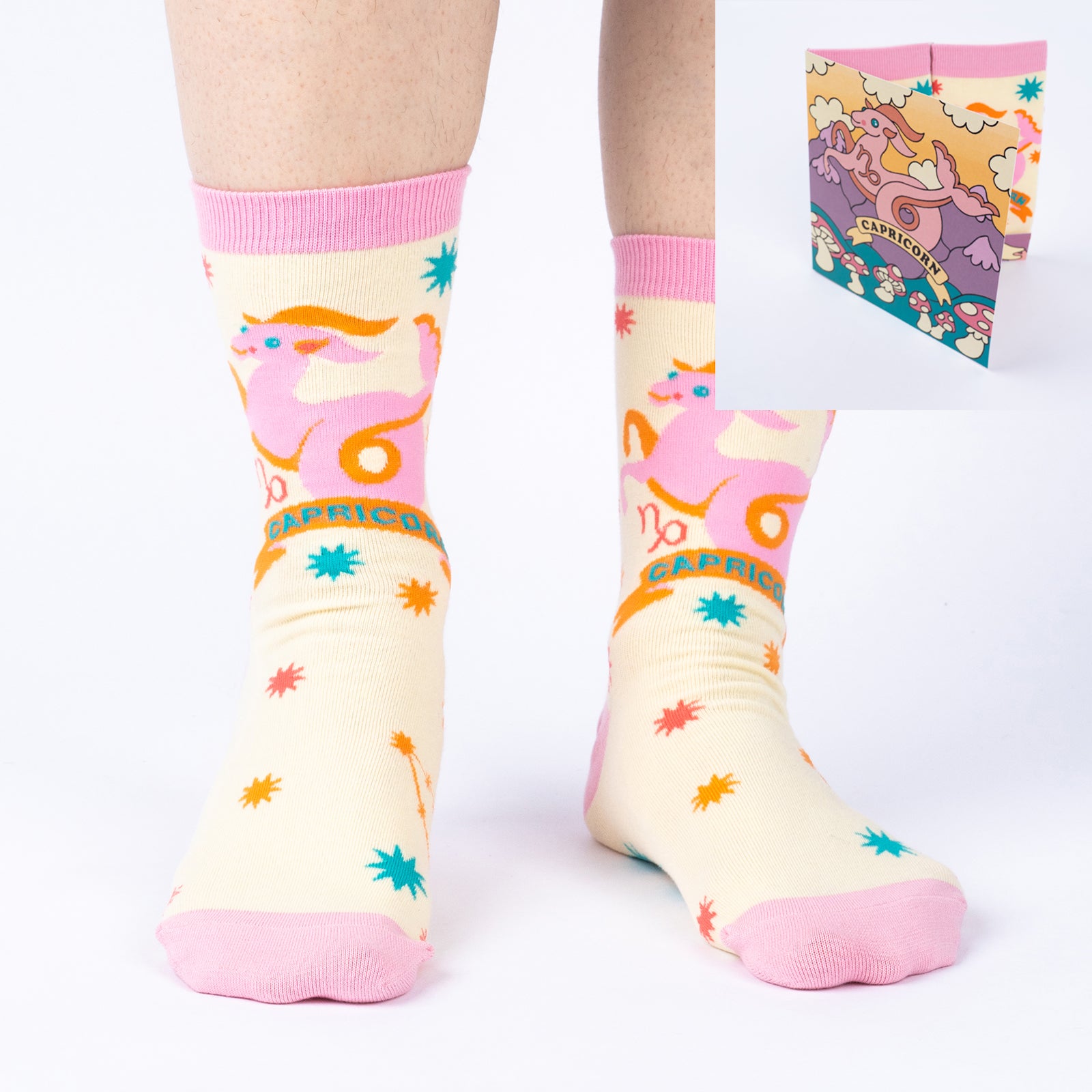 model wearing Capricorn crew socks with inset image of Capricorn greeting card in corner
